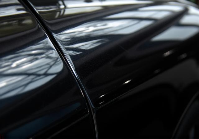 Flawless mirror finish on black Mercedes paint after correction